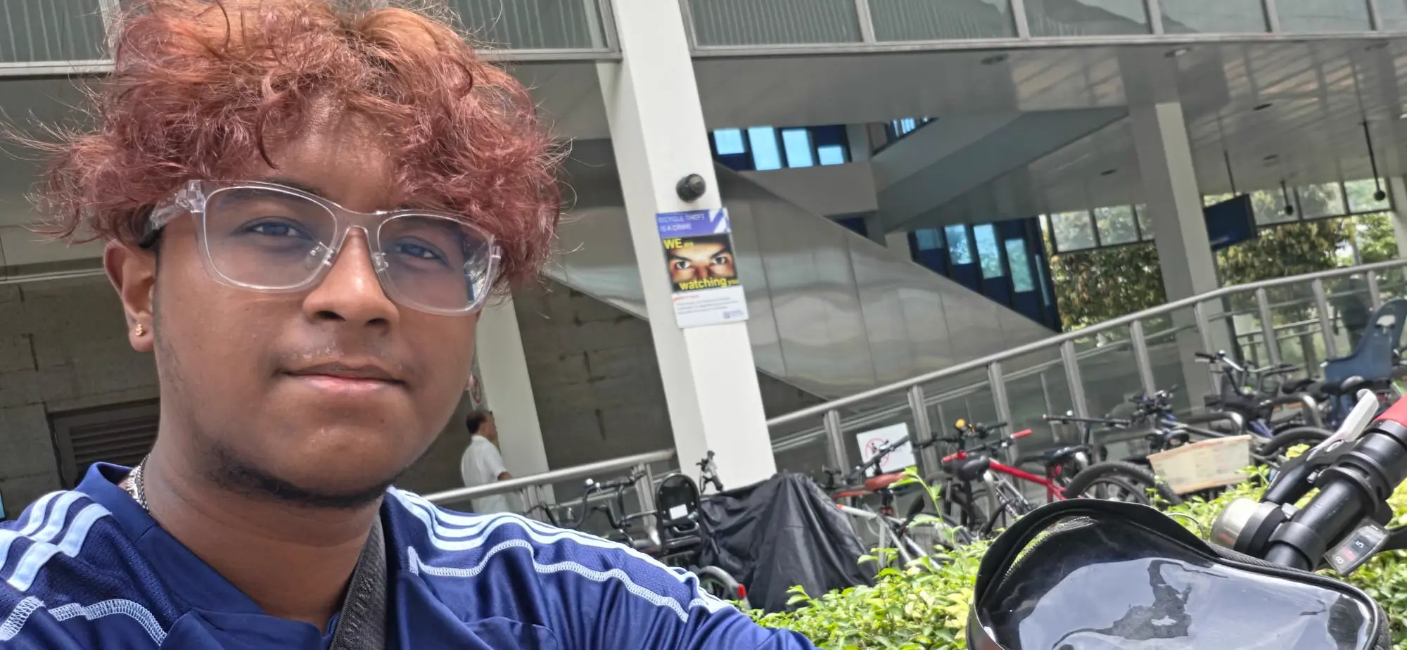Picture of Shiva standing outside Bukit Panjang MRT station at the bike rack area